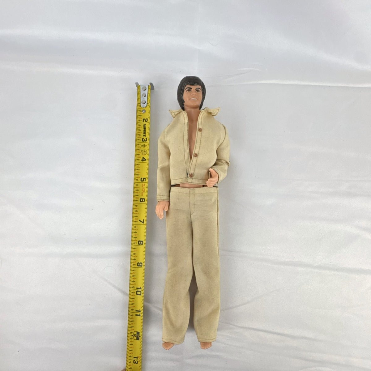 Vintage 1976 Mattel Donny Osmond 12-inch fashion doll wearing two-piece tan leisure suit