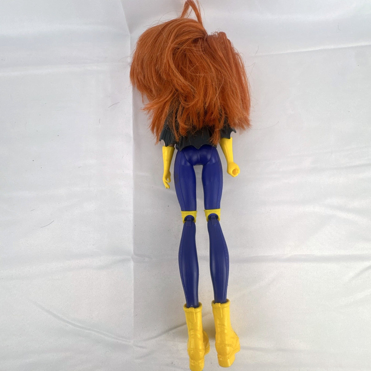 Mattel DC Super Hero Girls Batgirl 12-inch doll with purple suit, yellow boots, and red hair