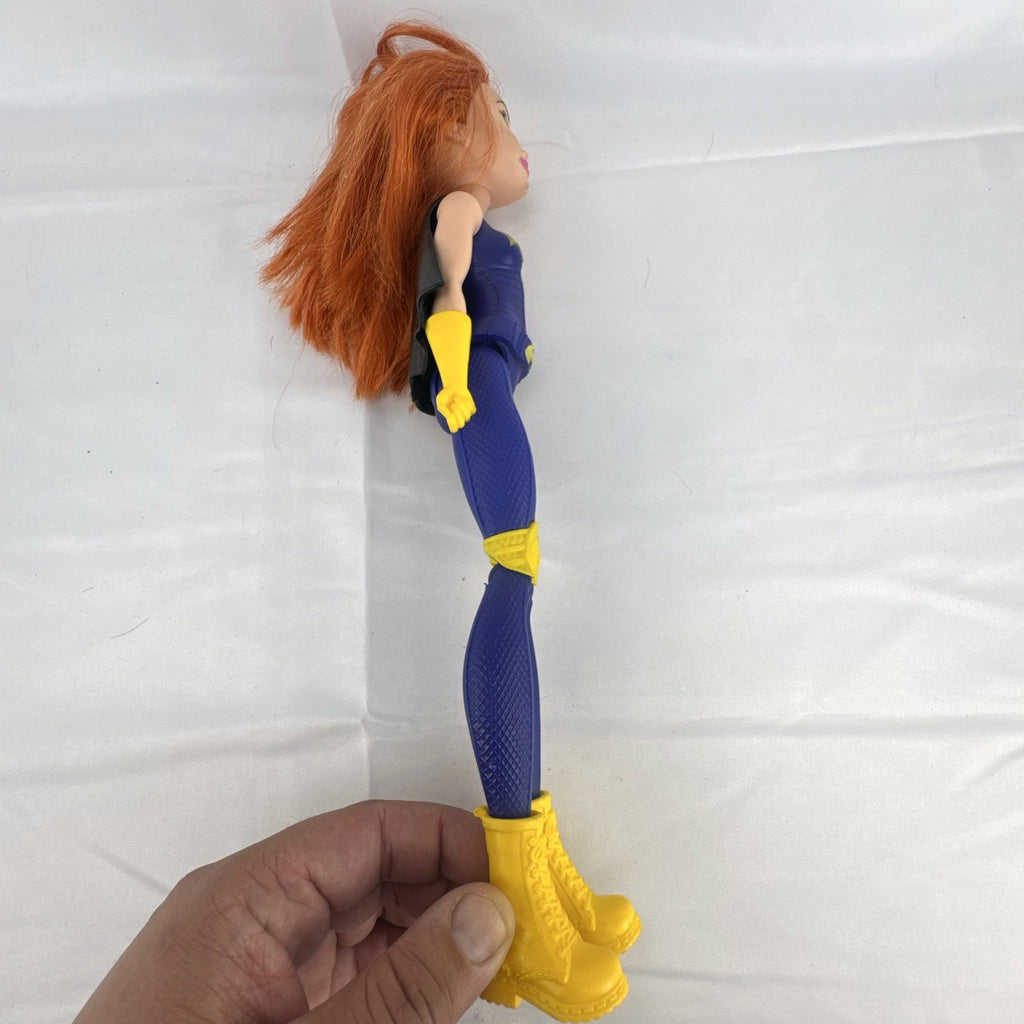 Mattel DC Super Hero Girls Batgirl 12-inch doll with purple suit, yellow boots, and red hair