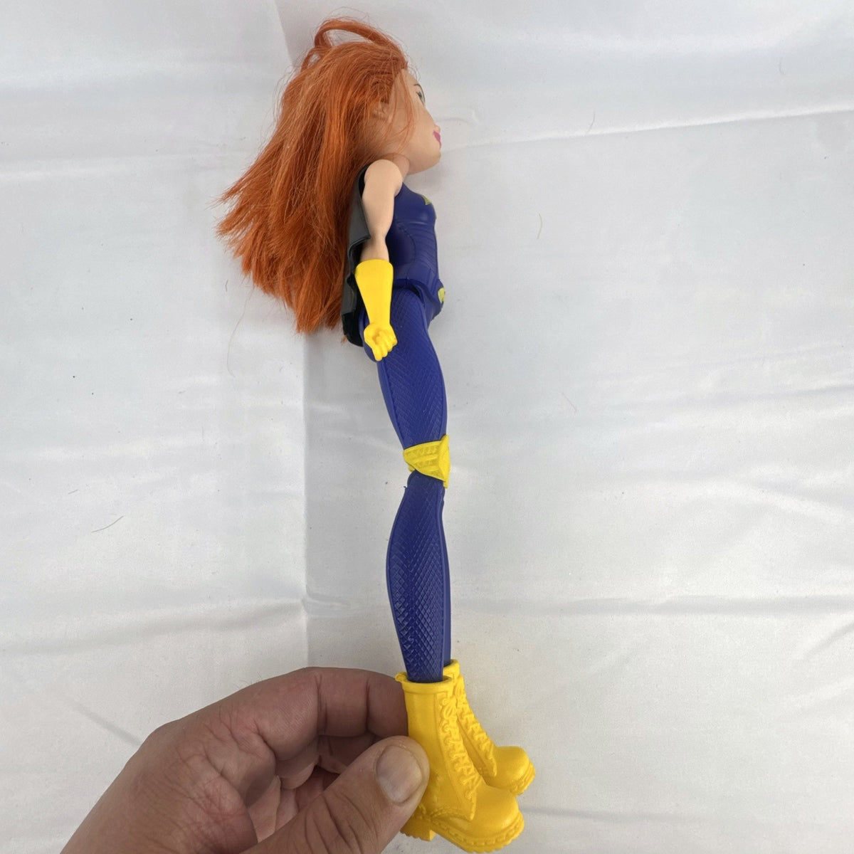 Mattel DC Super Hero Girls Batgirl 12-inch doll with purple suit, yellow boots, and red hair