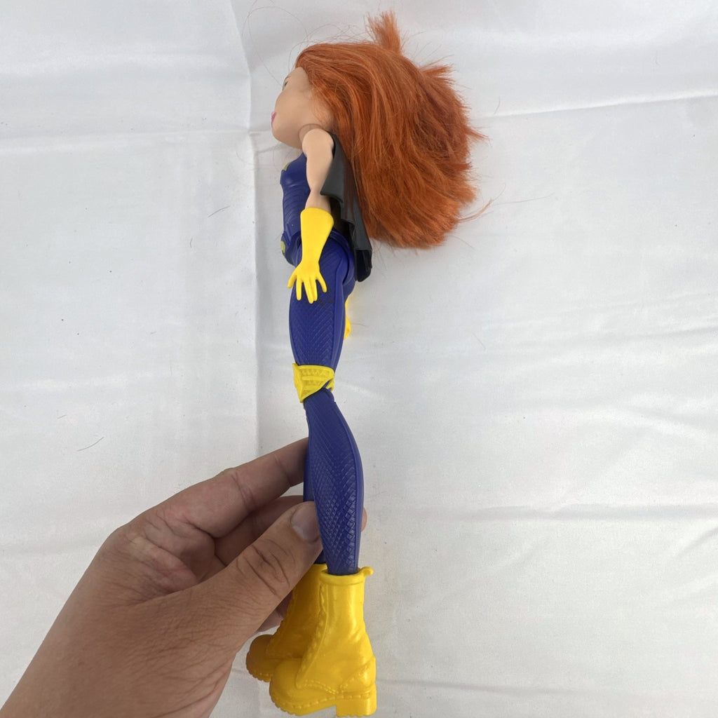 Mattel DC Super Hero Girls Batgirl 12-inch doll with purple suit, yellow boots, and red hair