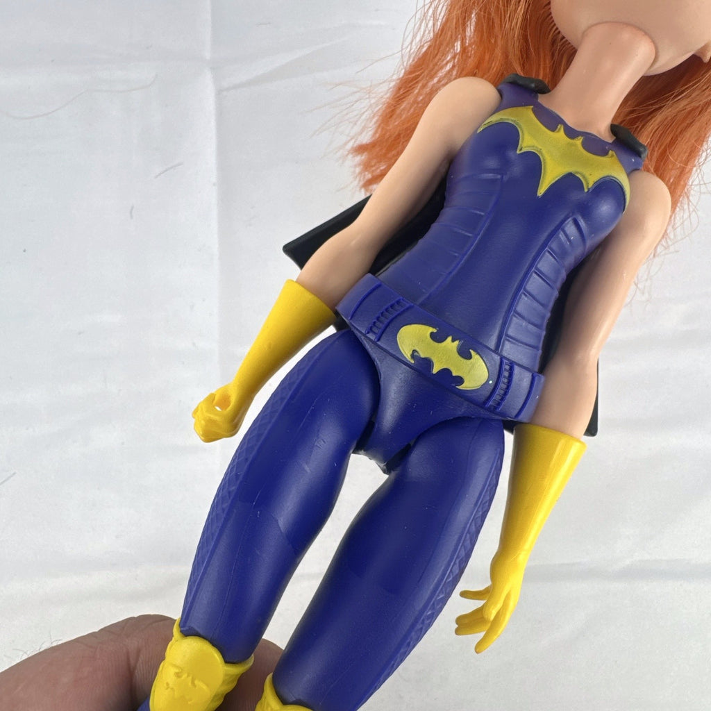 Mattel DC Super Hero Girls Batgirl 12-inch doll with purple suit, yellow boots, and red hair