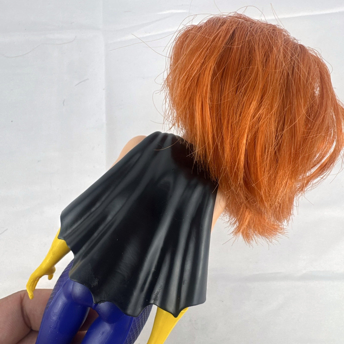 Mattel DC Super Hero Girls Batgirl 12-inch doll with purple suit, yellow boots, and red hair