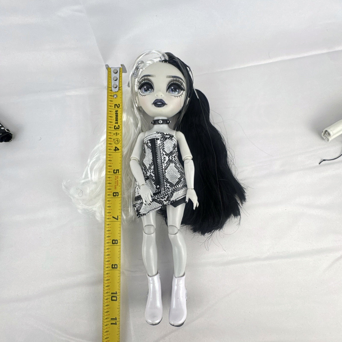 MGA Shadow High Heather Grayson 11-inch fashion doll with split black and white hair and clothing accessories
