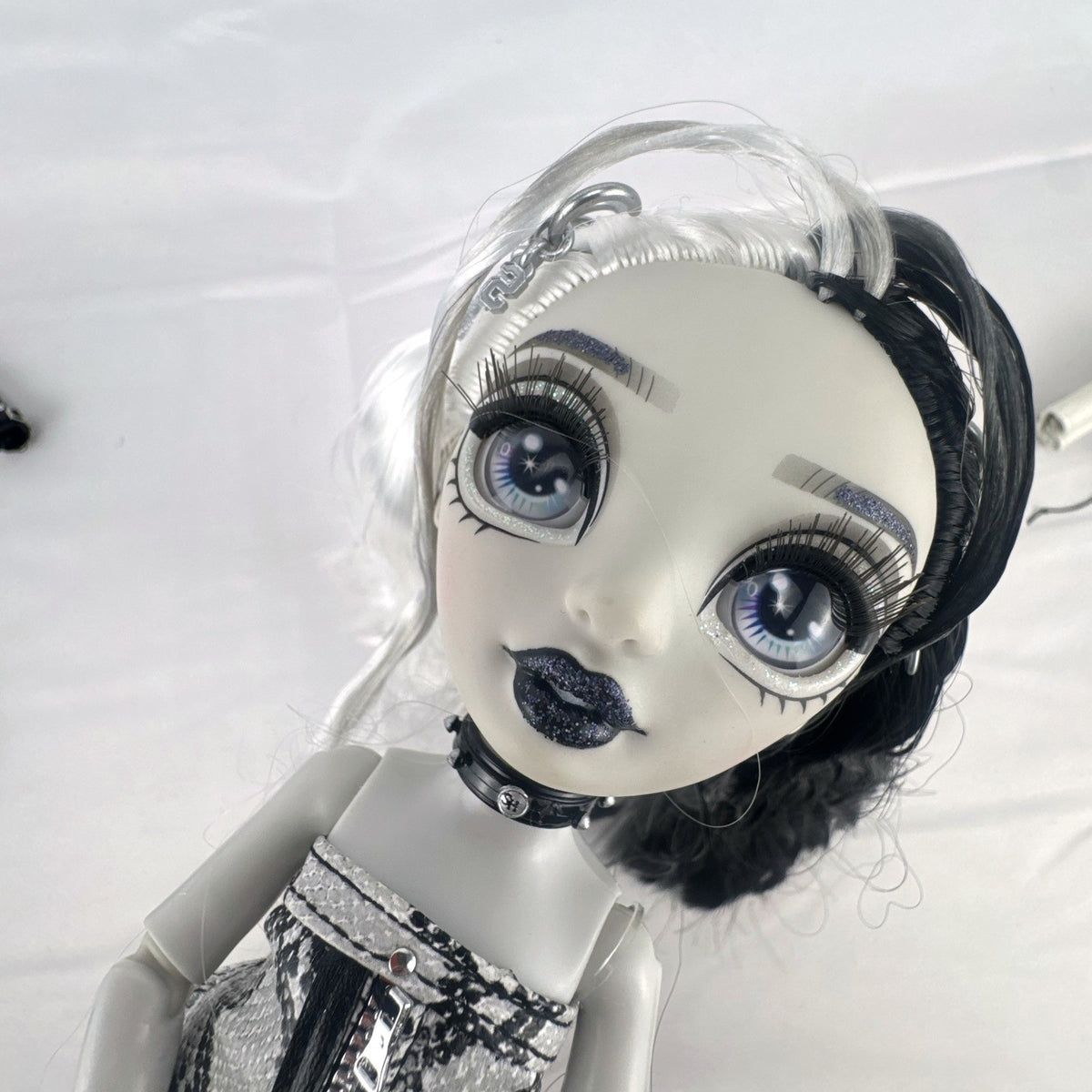 MGA Shadow High Heather Grayson 11-inch fashion doll with split black and white hair and clothing accessories