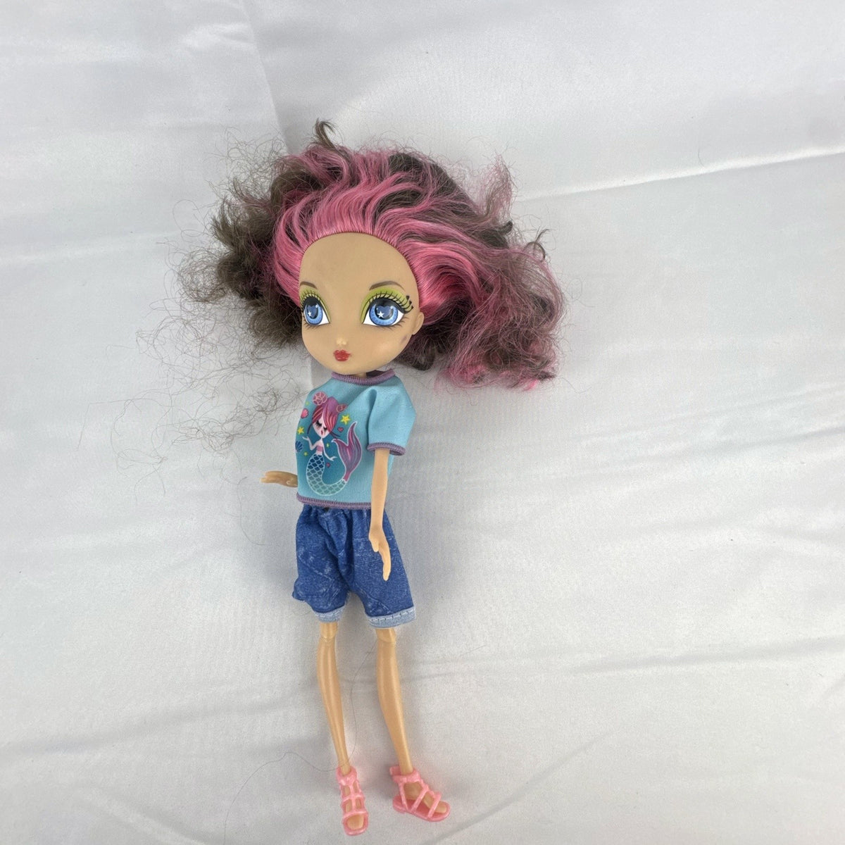 Spin Master La Dee Da Dee 10-inch fashion doll in blue mermaid outfit with brown and pink hair