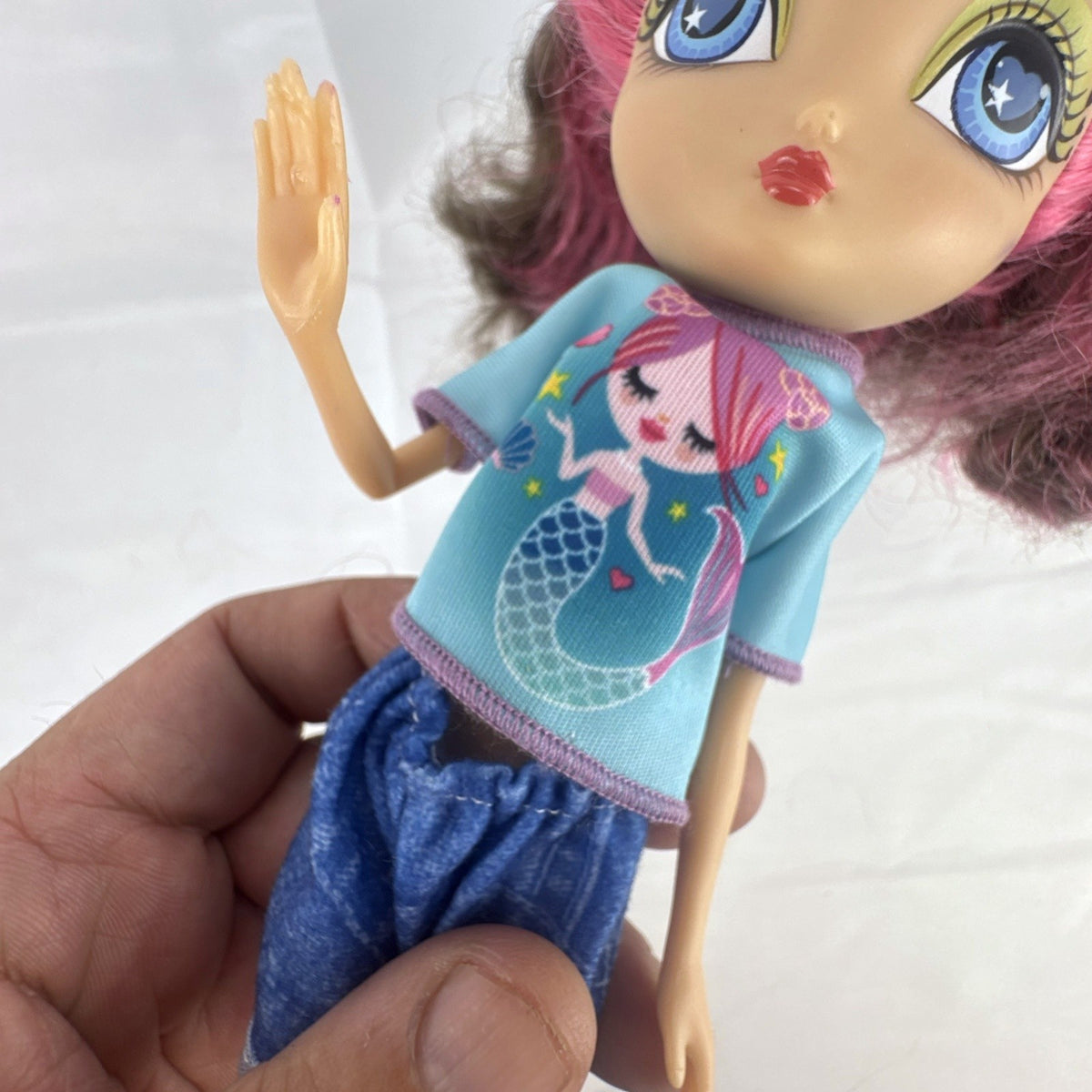Spin Master La Dee Da Dee 10-inch fashion doll in blue mermaid outfit with brown and pink hair