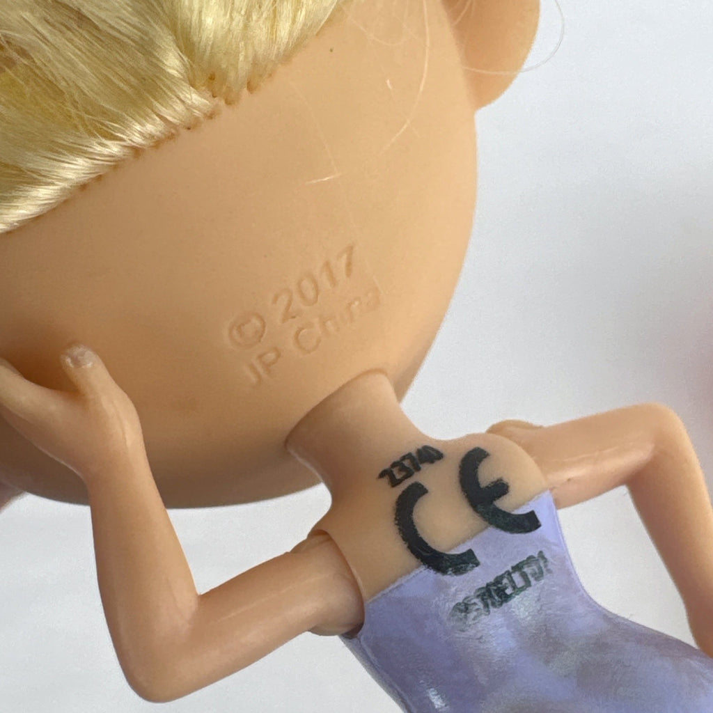 Four Just Play Hairdorables and Shortcuts mini fashion figures with colorful rooted hair