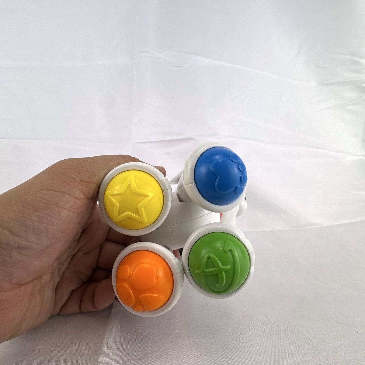Fisher-Price crawl along Dalmatian puppy toy with colorful roller ball feet