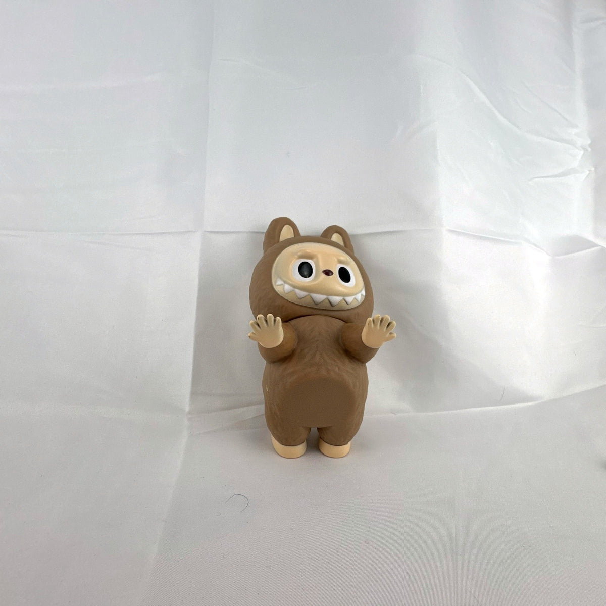 Pop Mart The Monsters Squant vinyl art figure by Kasing Lung in brown