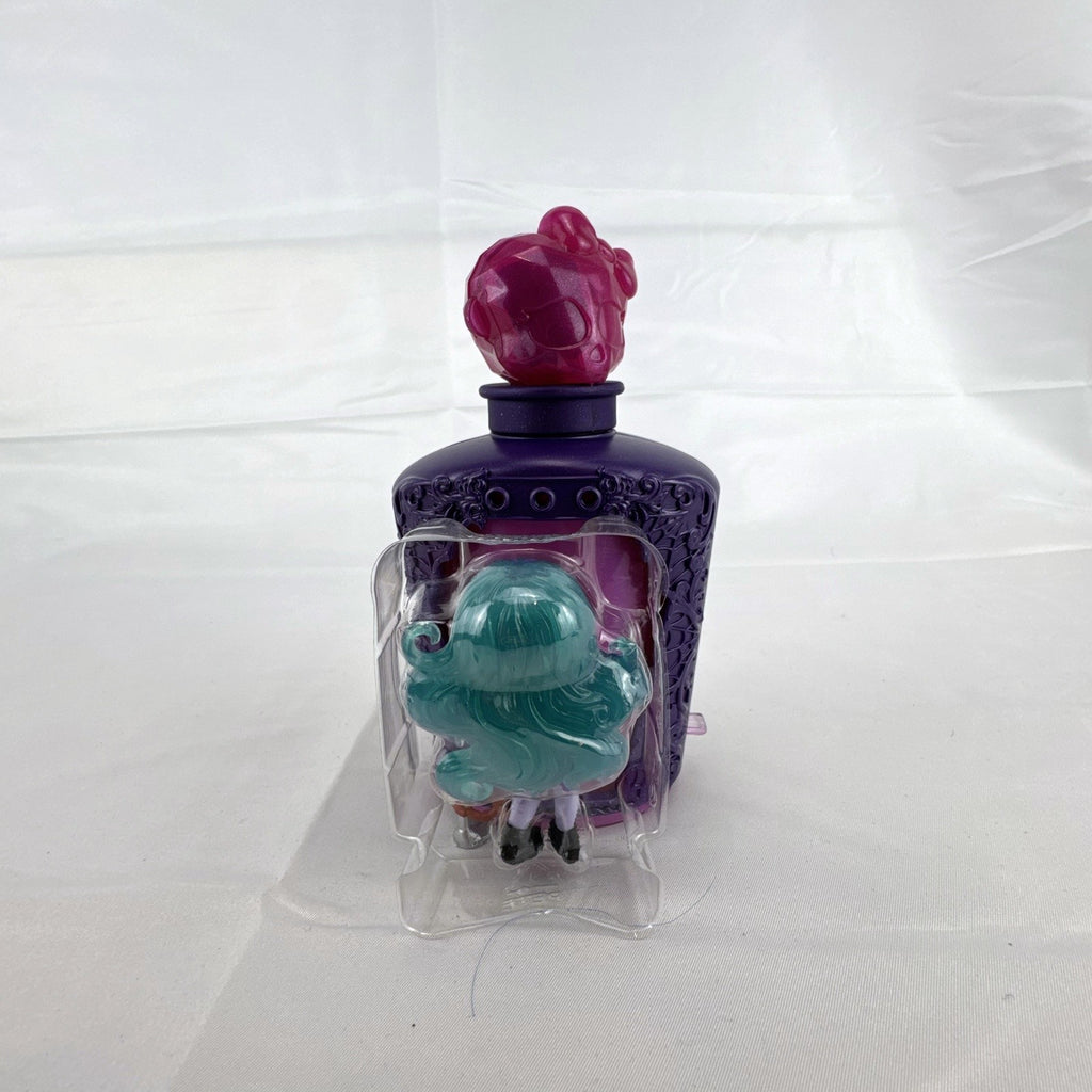 Mattel Monster High Potions Twyla mini figure inside purple potion bottle container with crystal skull topper
