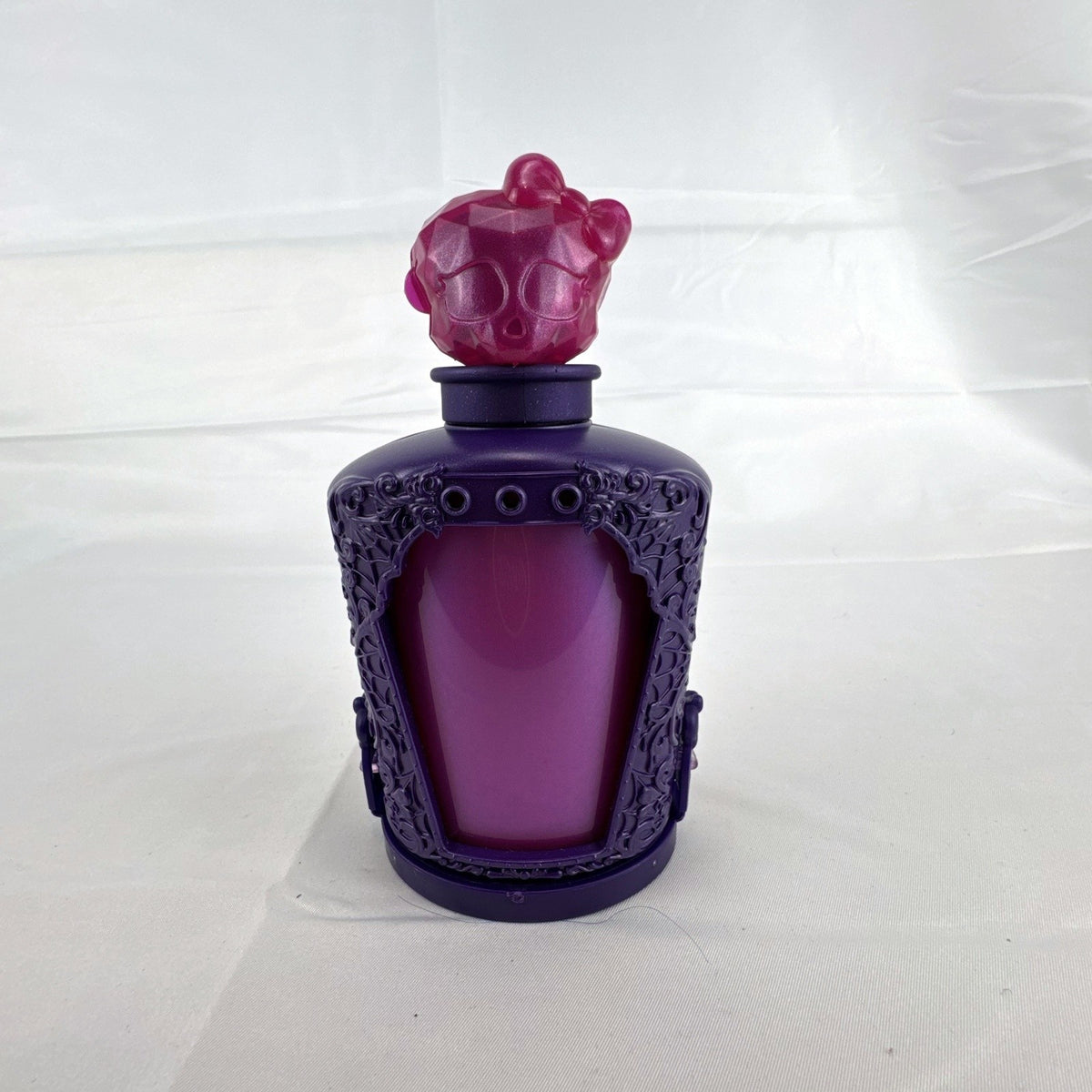 Mattel Monster High Potions Twyla mini figure inside purple potion bottle container with crystal skull topper