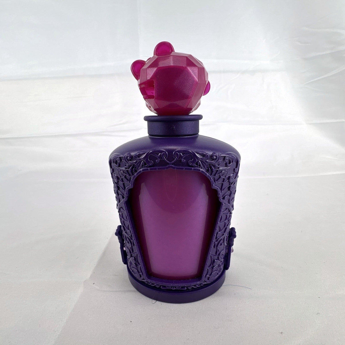 Mattel Monster High Potions Twyla mini figure inside purple potion bottle container with crystal skull topper