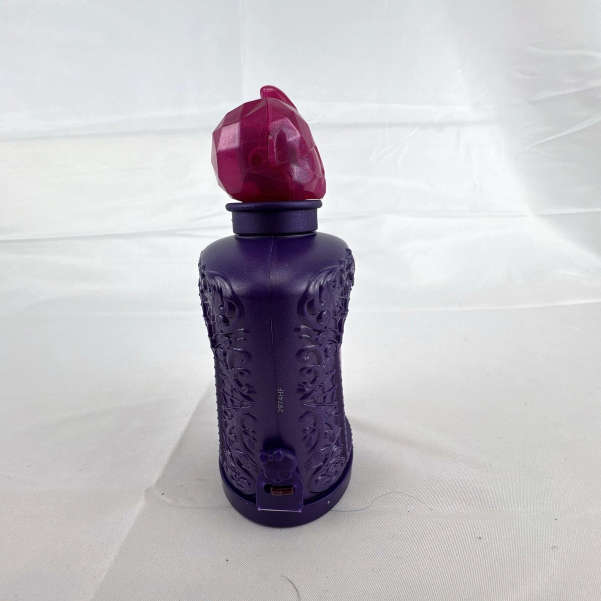 Mattel Monster High Potions Twyla mini figure inside purple potion bottle container with crystal skull topper
