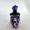 Mattel Monster High Spectra Vondergeist 3-inch mini doll inside a purple and black Skullette potion bottle display case.