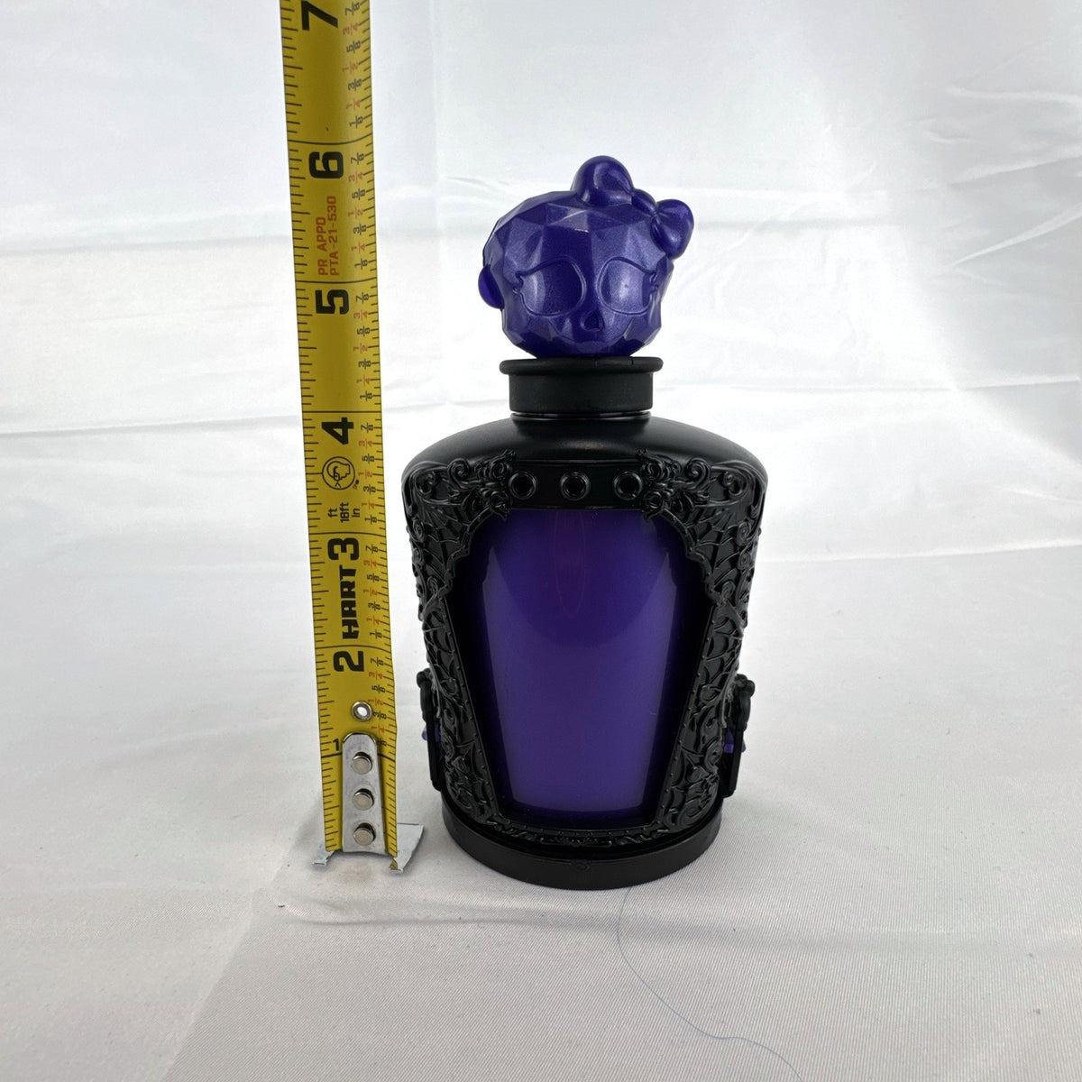 Mattel Monster High Spectra Vondergeist 3-inch mini doll inside a purple and black Skullette potion bottle display case.