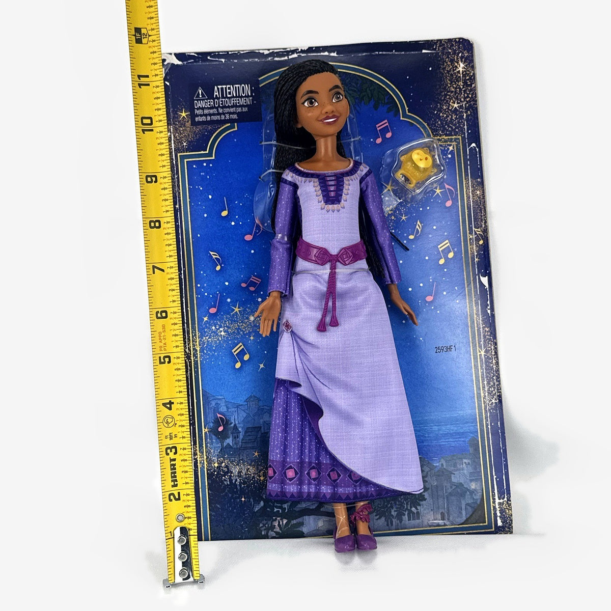 Mattel Disney Wish singing Asha 11-inch fashion doll in purple gown with yellow Star figure in original packaging