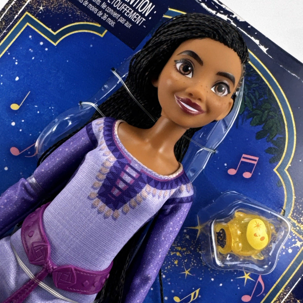 Mattel Disney Wish singing Asha 11-inch fashion doll in purple gown with yellow Star figure in original packaging