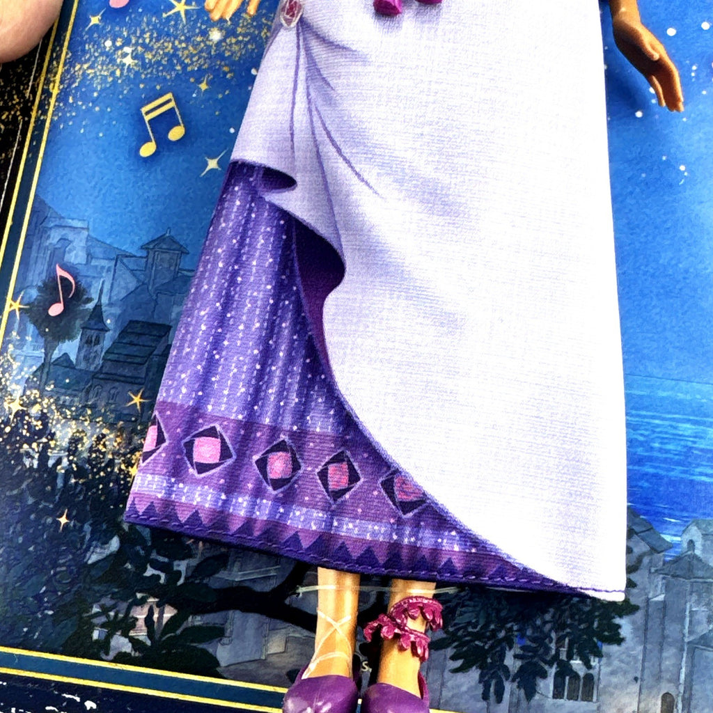 Mattel Disney Wish singing Asha 11-inch fashion doll in purple gown with yellow Star figure in original packaging