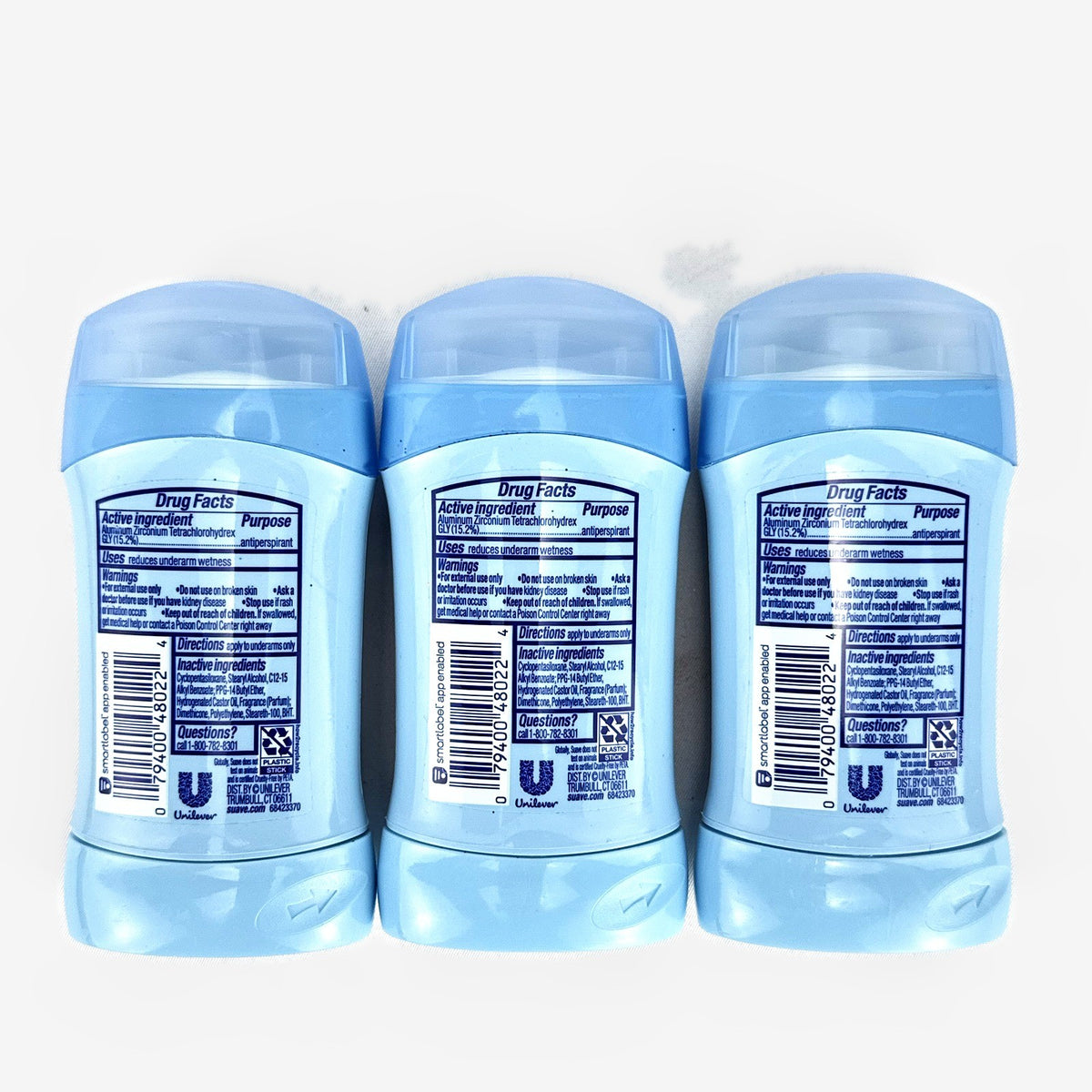 Three-pack of Suave invisible solid travel size powder antiperspirant deodorant sticks.