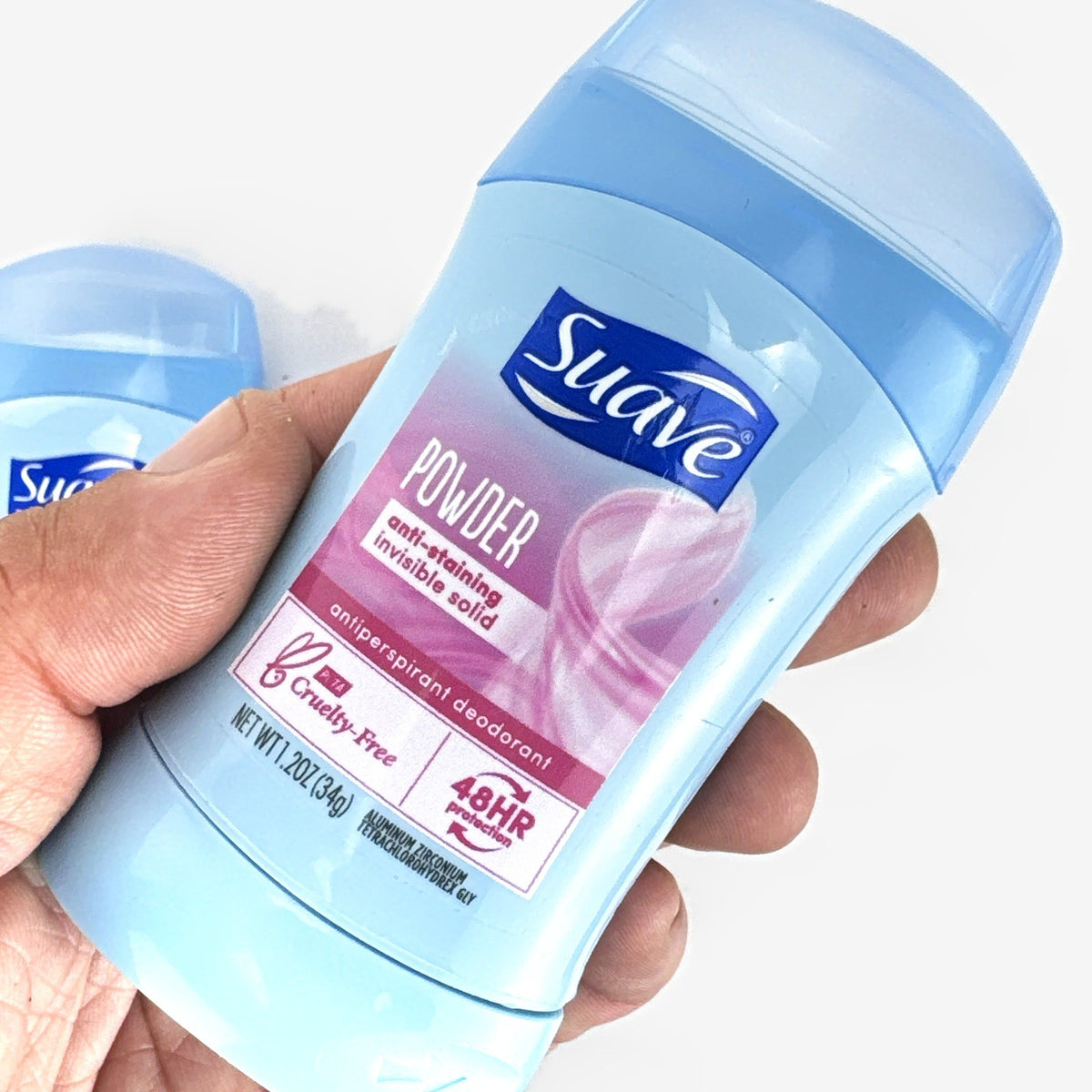 Three-pack of Suave invisible solid travel size powder antiperspirant deodorant sticks.
