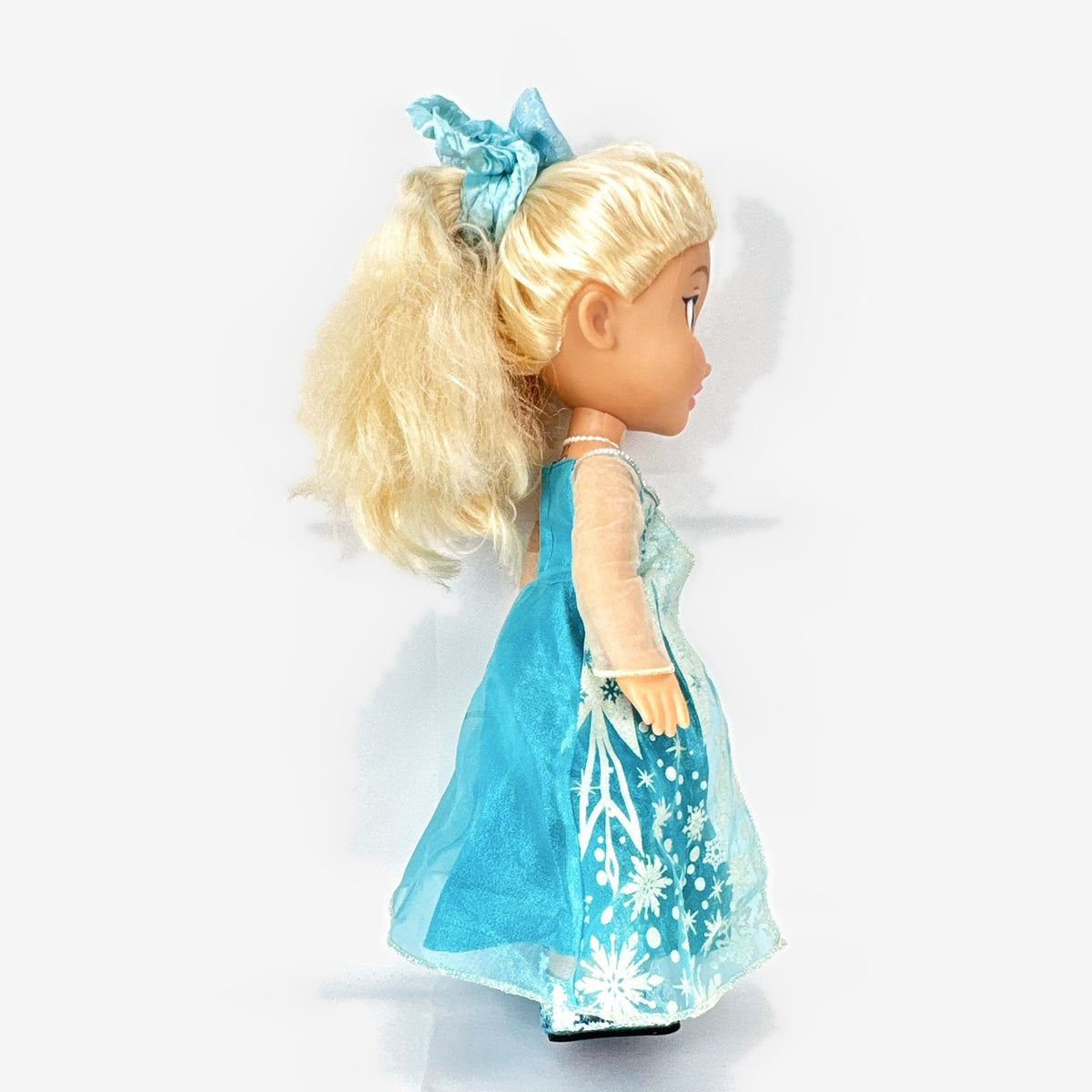Jakks Pacific Disney Frozen Snow Glow Elsa 14-inch toddler doll wearing ice gown and glitter shoes