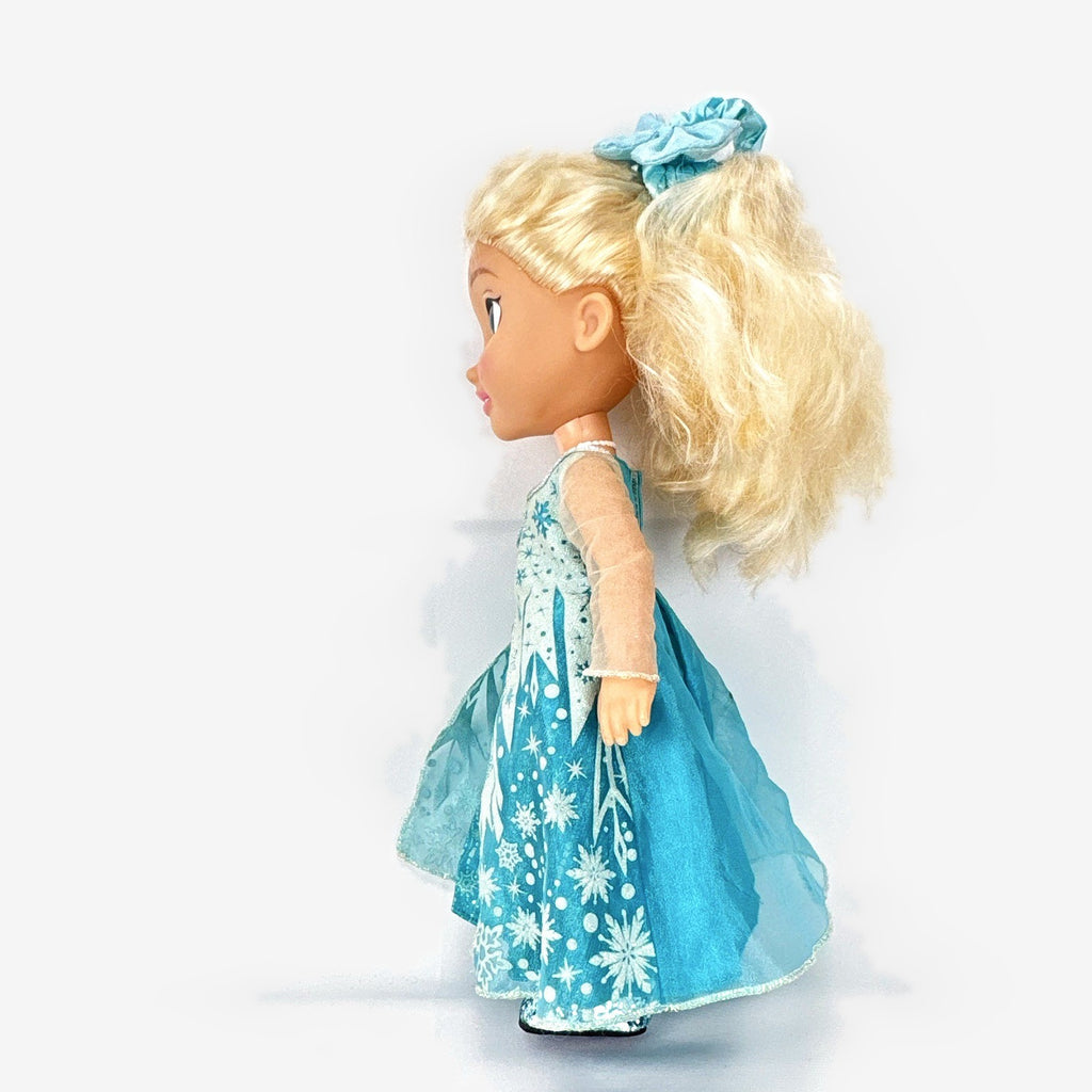 Jakks Pacific Disney Frozen Snow Glow Elsa 14-inch toddler doll wearing ice gown and glitter shoes