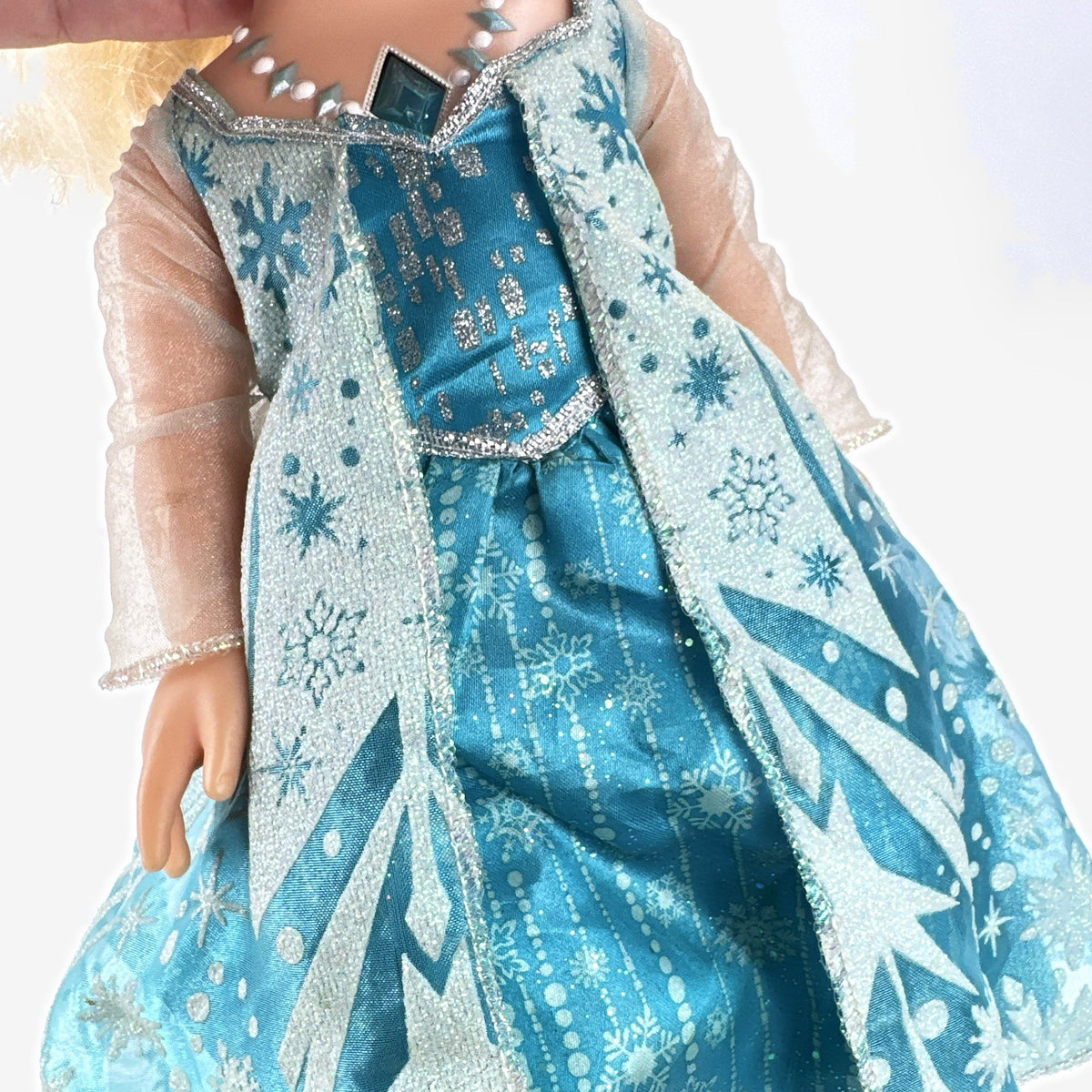 Jakks Pacific Disney Frozen Snow Glow Elsa 14-inch toddler doll wearing ice gown and glitter shoes