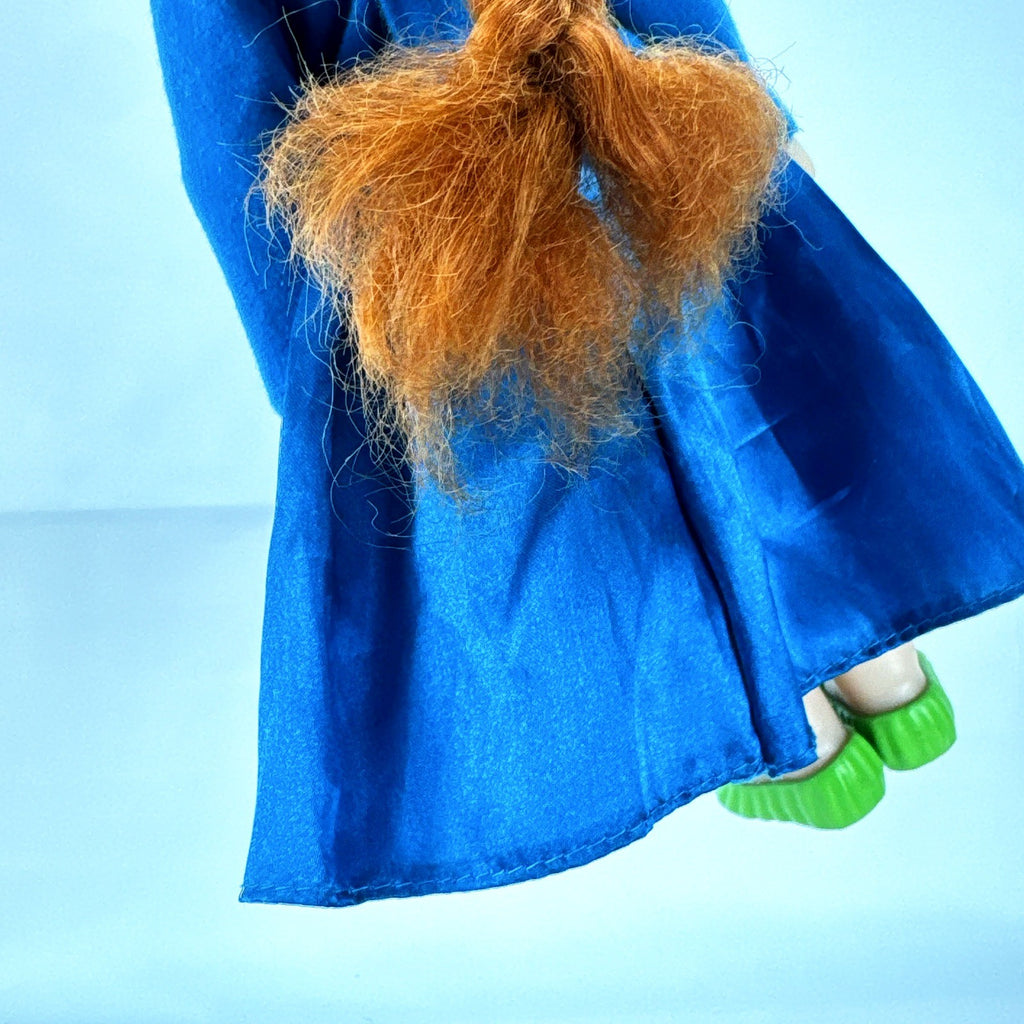 Disney Frozen 13-inch toddler Anna doll wearing blue dress and green pom-pom shoes
