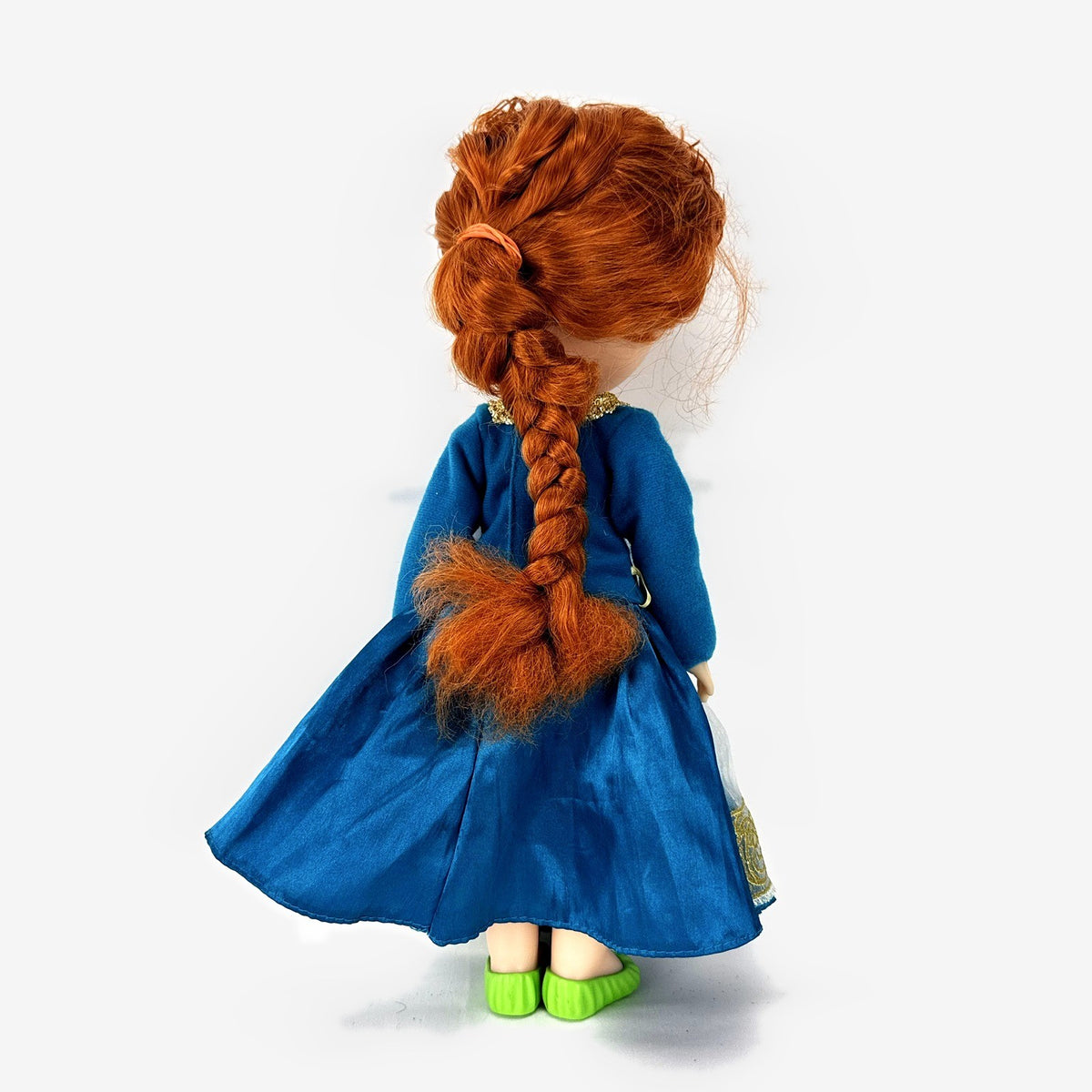 Disney Frozen 13-inch toddler Anna doll wearing blue dress and green pom-pom shoes