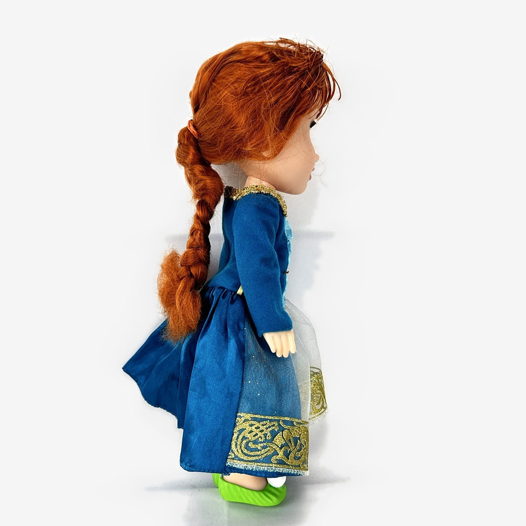 Disney Frozen 13-inch toddler Anna doll wearing blue dress and green pom-pom shoes