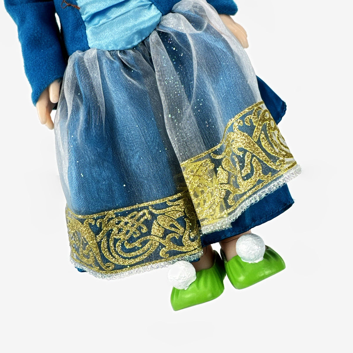 Disney Frozen 13-inch toddler Anna doll wearing blue dress and green pom-pom shoes