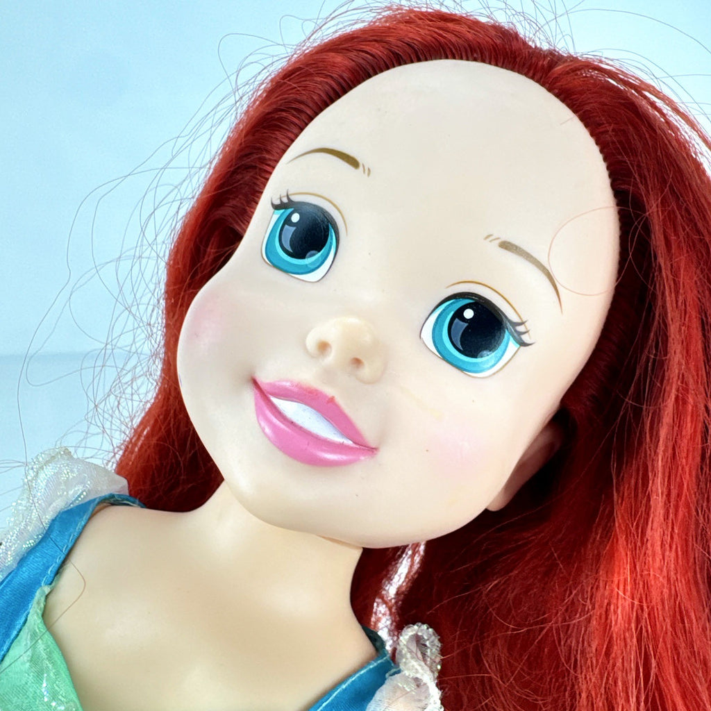 Jakks Pacific Disney Princess Ariel 14-inch toddler doll wearing seafoam green dress