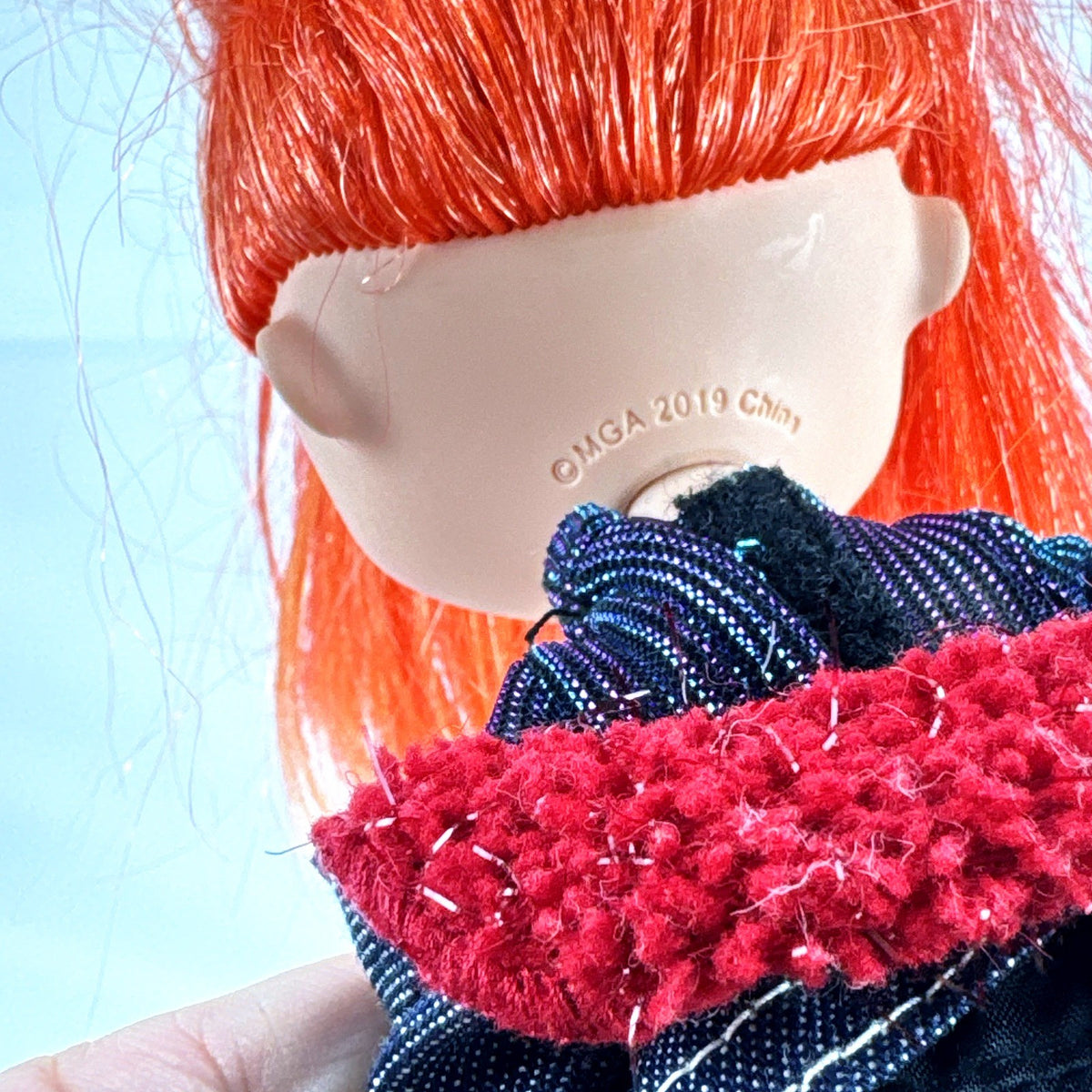 MGA L.O.L. Surprise! O.M.G. 10-inch fashion doll with orange ponytail and black cargo pants outfit