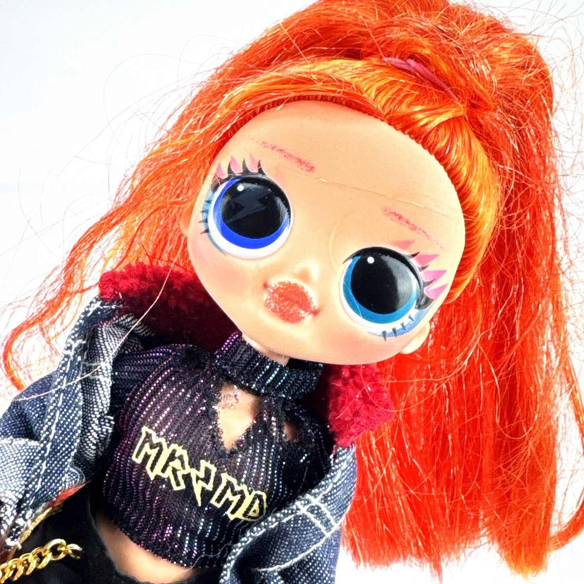 MGA L.O.L. Surprise! O.M.G. 10-inch fashion doll with orange ponytail and black cargo pants outfit