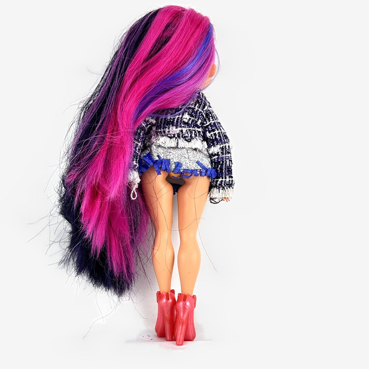 MGA L.O.L. Surprise! O.M.G. Alt Grrrl fashion doll with split pink and black hair, metallic bodysuit, and red heels