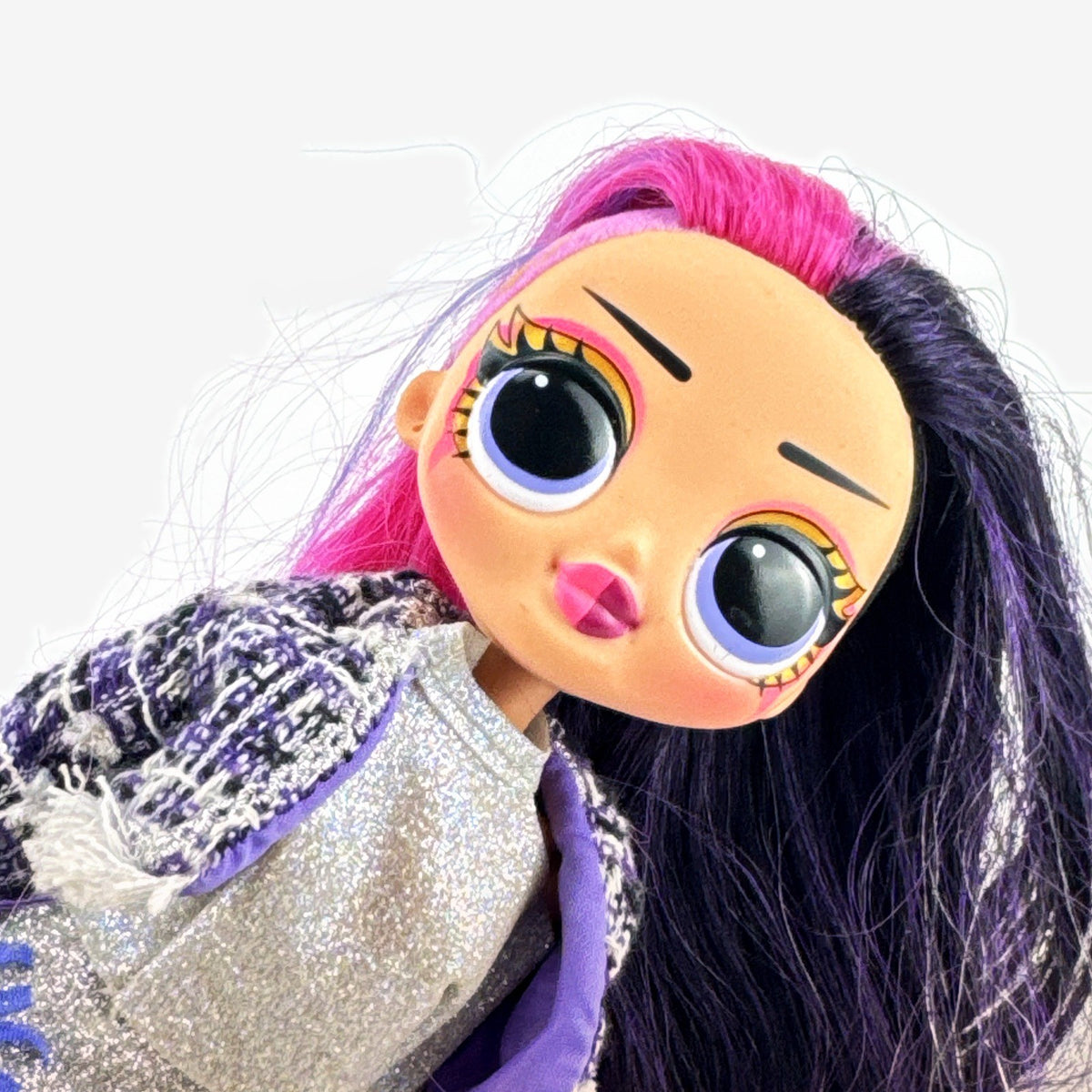 MGA L.O.L. Surprise! O.M.G. Alt Grrrl fashion doll with split pink and black hair, metallic bodysuit, and red heels