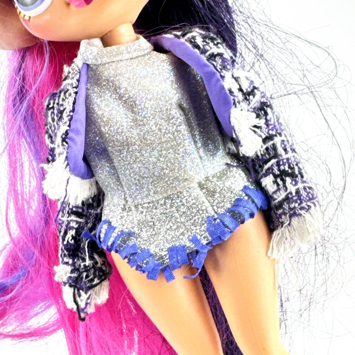 MGA L.O.L. Surprise! O.M.G. Alt Grrrl fashion doll with split pink and black hair, metallic bodysuit, and red heels