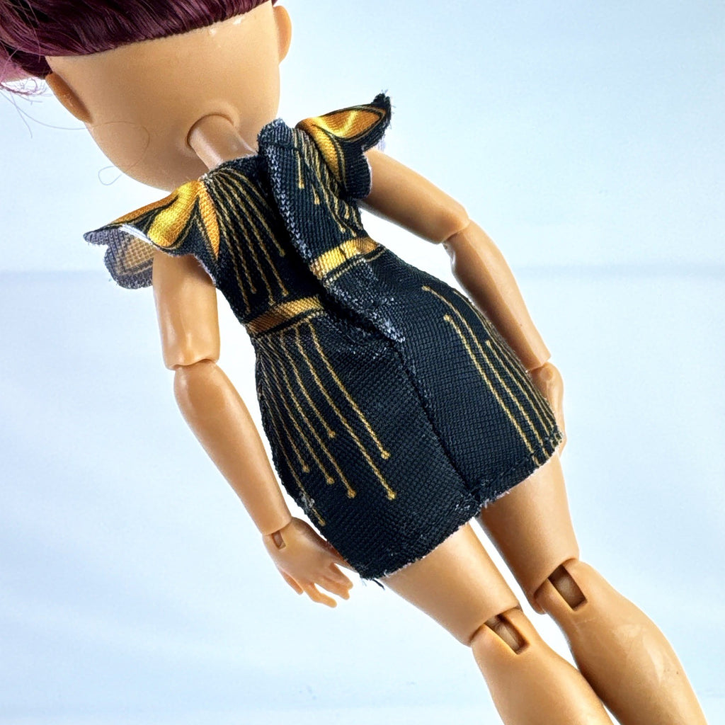 Moose Toys FailFix Dance Stylz fashion doll wearing black and gold dress with burgundy updo