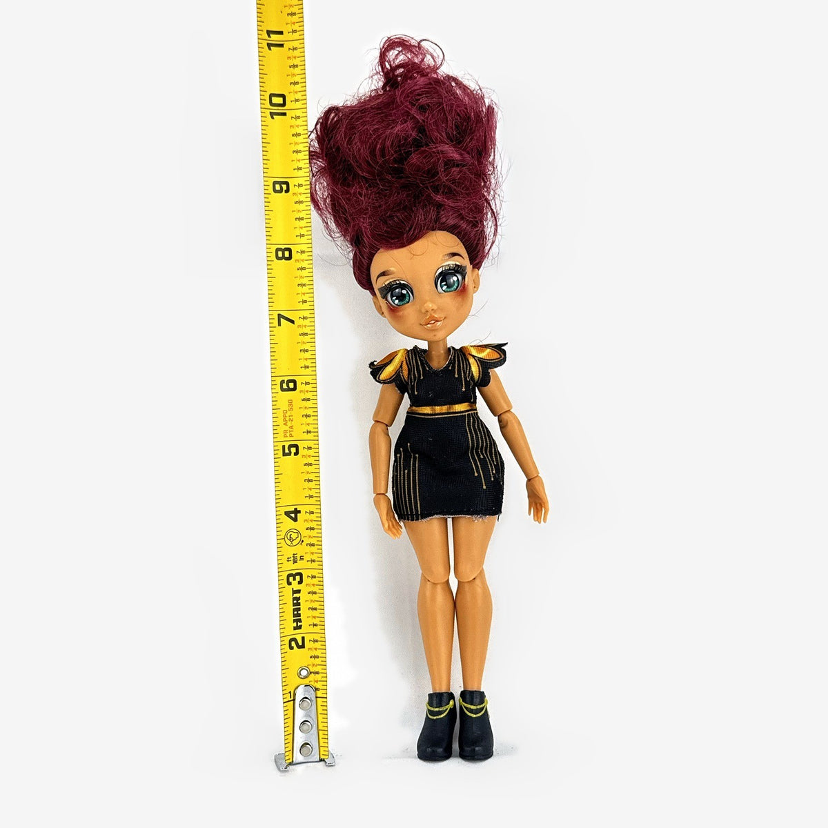 Moose Toys FailFix Dance Stylz fashion doll wearing black and gold dress with burgundy updo