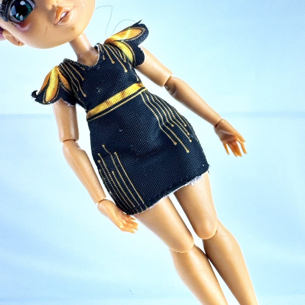 Moose Toys FailFix Dance Stylz fashion doll wearing black and gold dress with burgundy updo