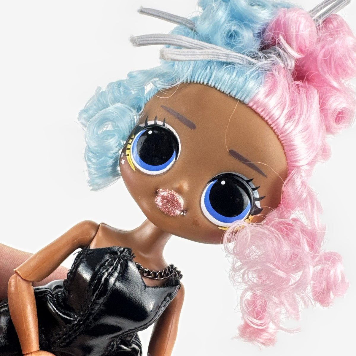 MGA L.O.L. Surprise! OMG Miss Royale 10-inch articulated doll with split pink and blue curls in a black corset dress