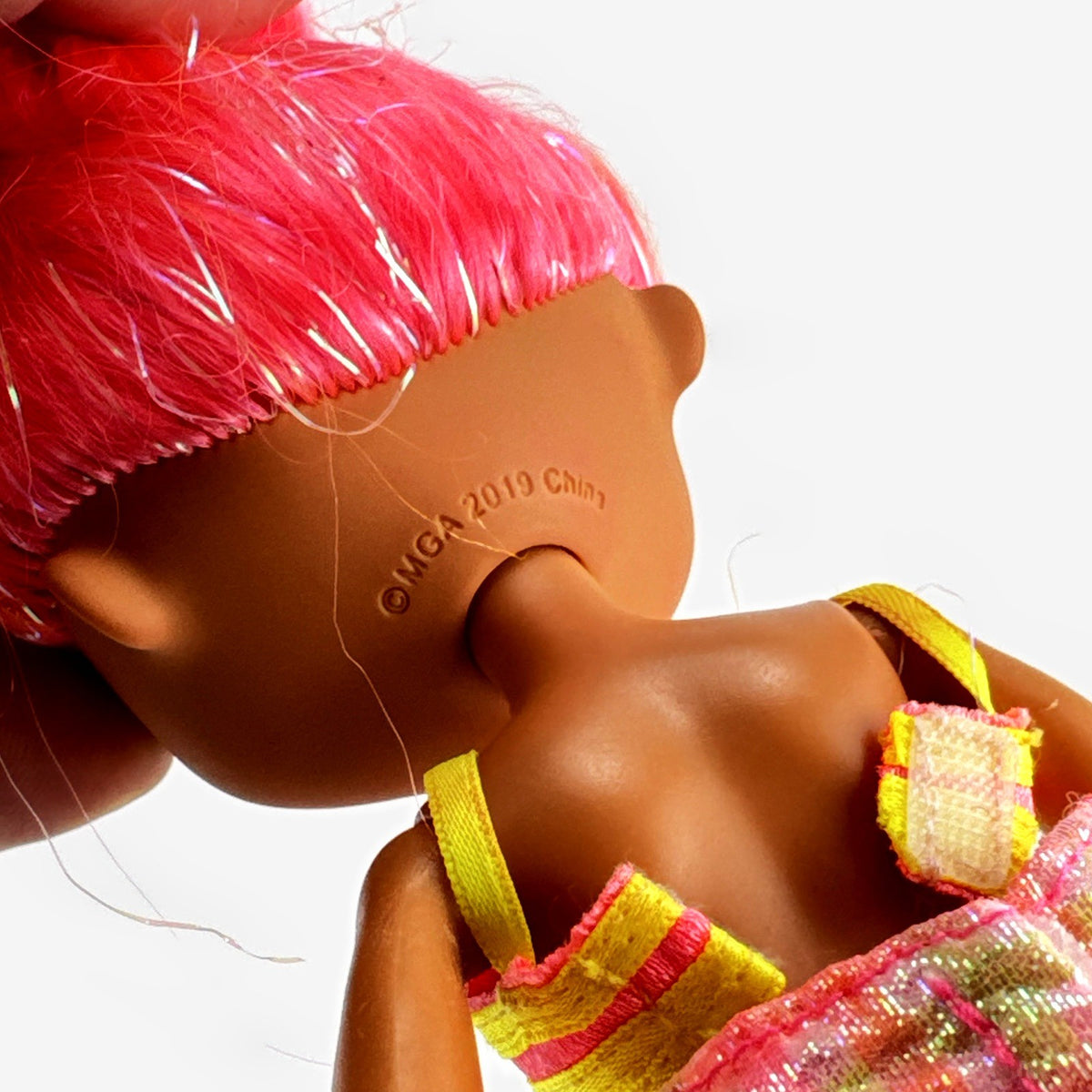 MGA L.O.L. Surprise! O.M.G. Lights Dazzle 10-inch doll in neon two-piece outfit with pink wedge boots