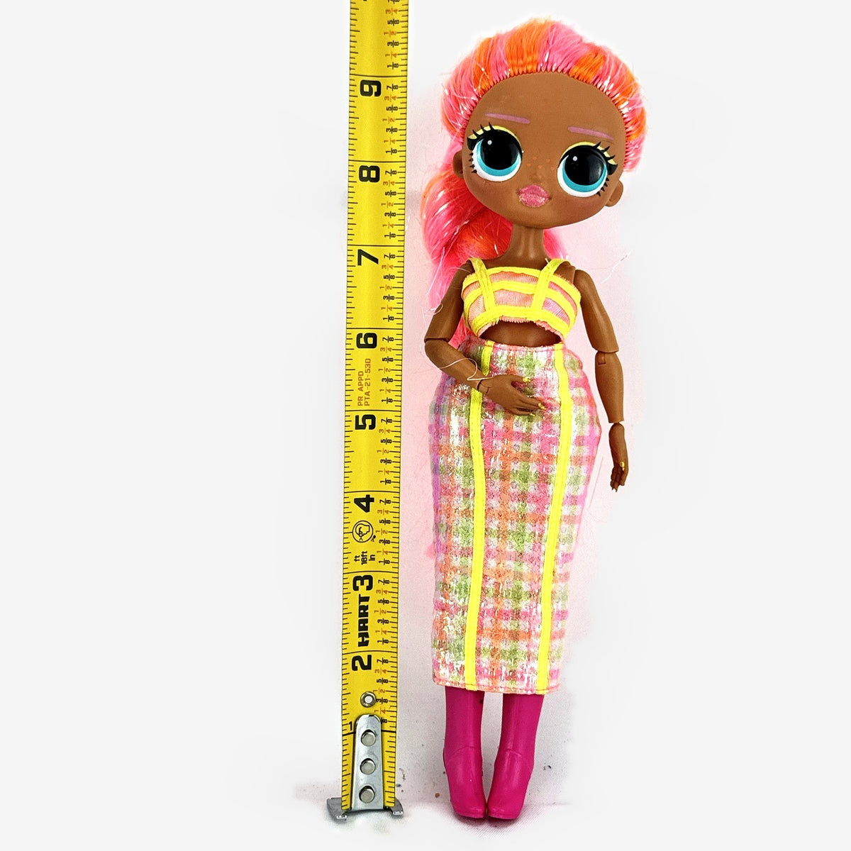 MGA L.O.L. Surprise! O.M.G. Lights Dazzle 10-inch doll in neon two-piece outfit with pink wedge boots