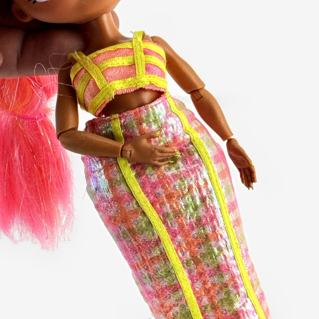 MGA L.O.L. Surprise! O.M.G. Lights Dazzle 10-inch doll in neon two-piece outfit with pink wedge boots