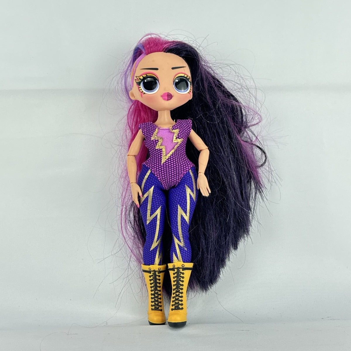 MGA L.O.L. Surprise! O.M.G. Remix Fame Queen 9-inch fashion doll wearing lightning bolt bodysuit and yellow platform boots