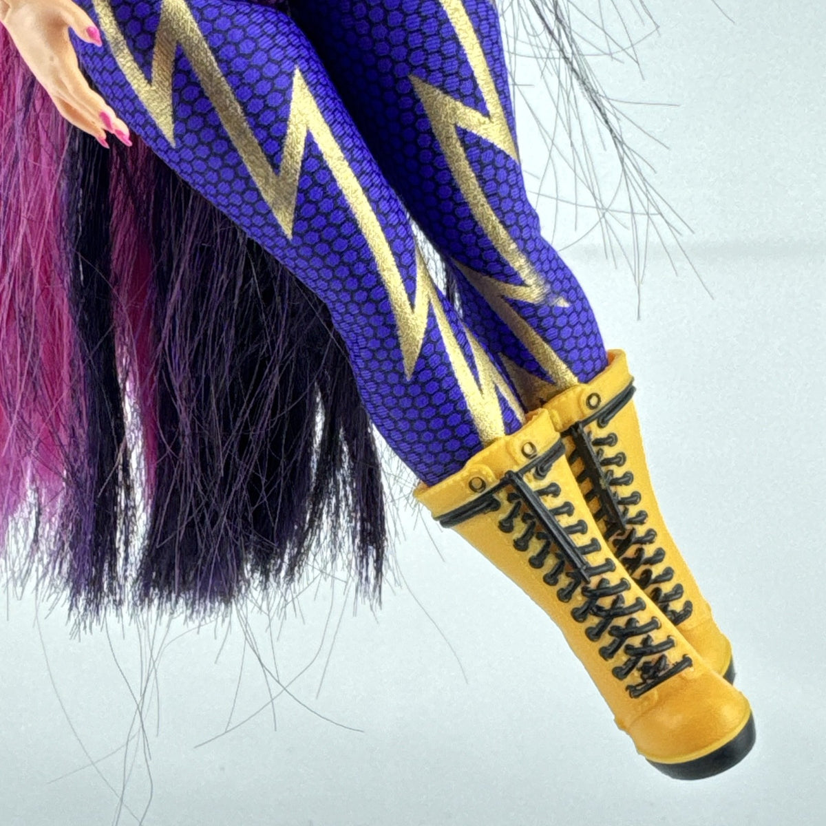 MGA L.O.L. Surprise! O.M.G. Remix Fame Queen 9-inch fashion doll wearing lightning bolt bodysuit and yellow platform boots