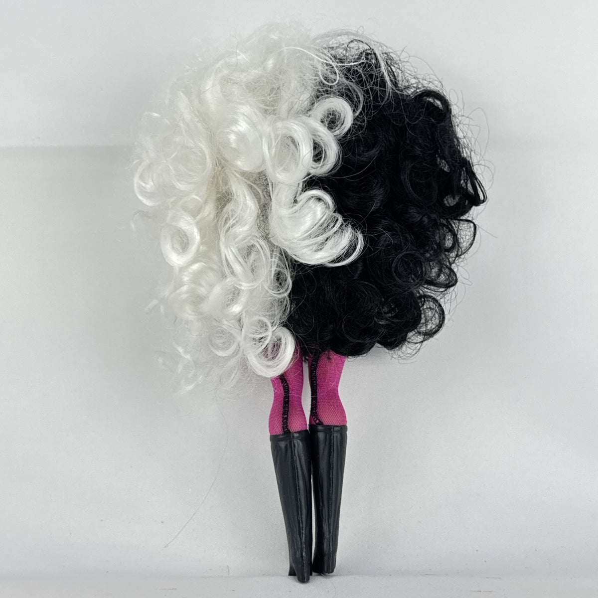 MGA L.O.L. Surprise O.M.G. Winter Disco Dollie fashion doll with split black and white curly hair and houndstooth dress