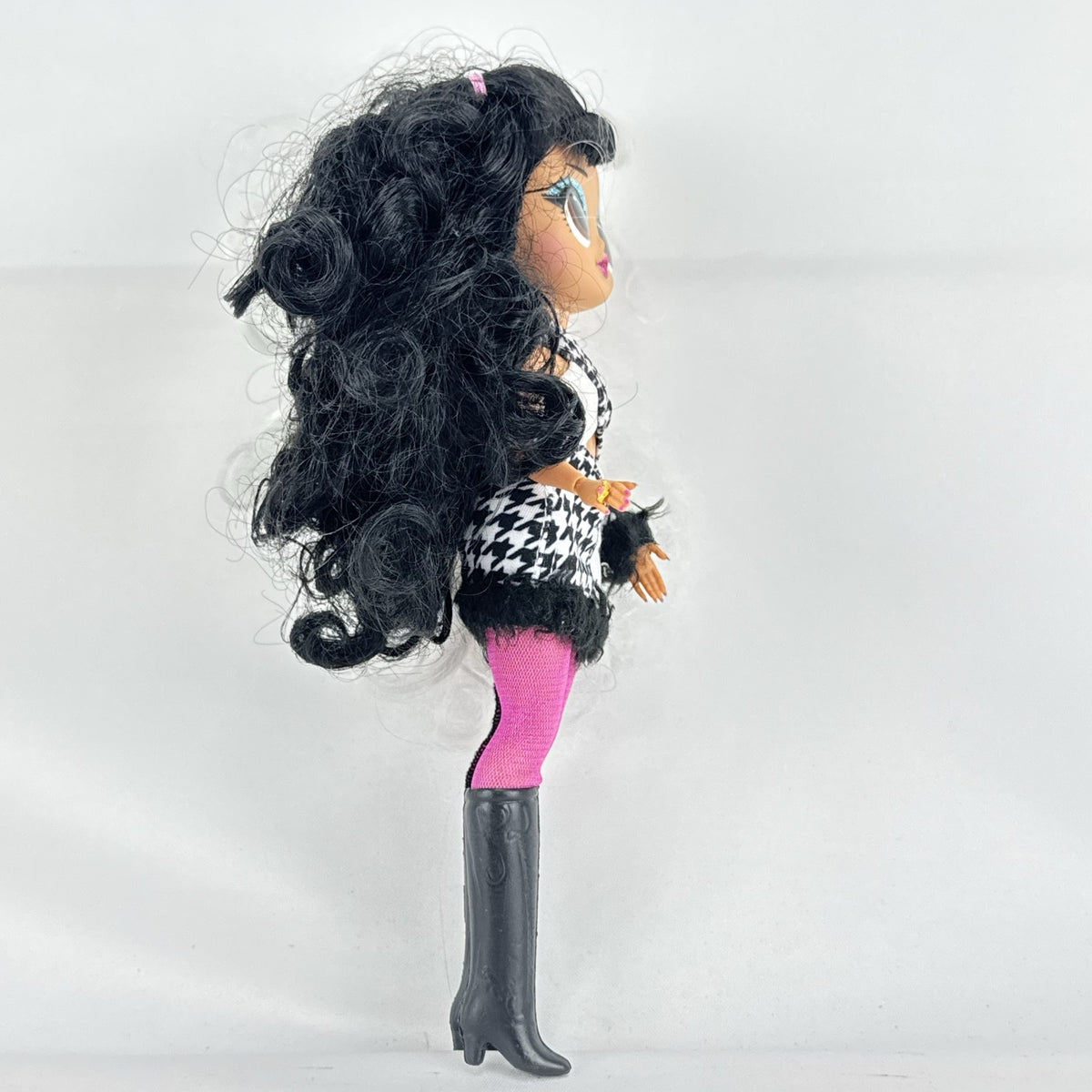 MGA L.O.L. Surprise O.M.G. Winter Disco Dollie fashion doll with split black and white curly hair and houndstooth dress