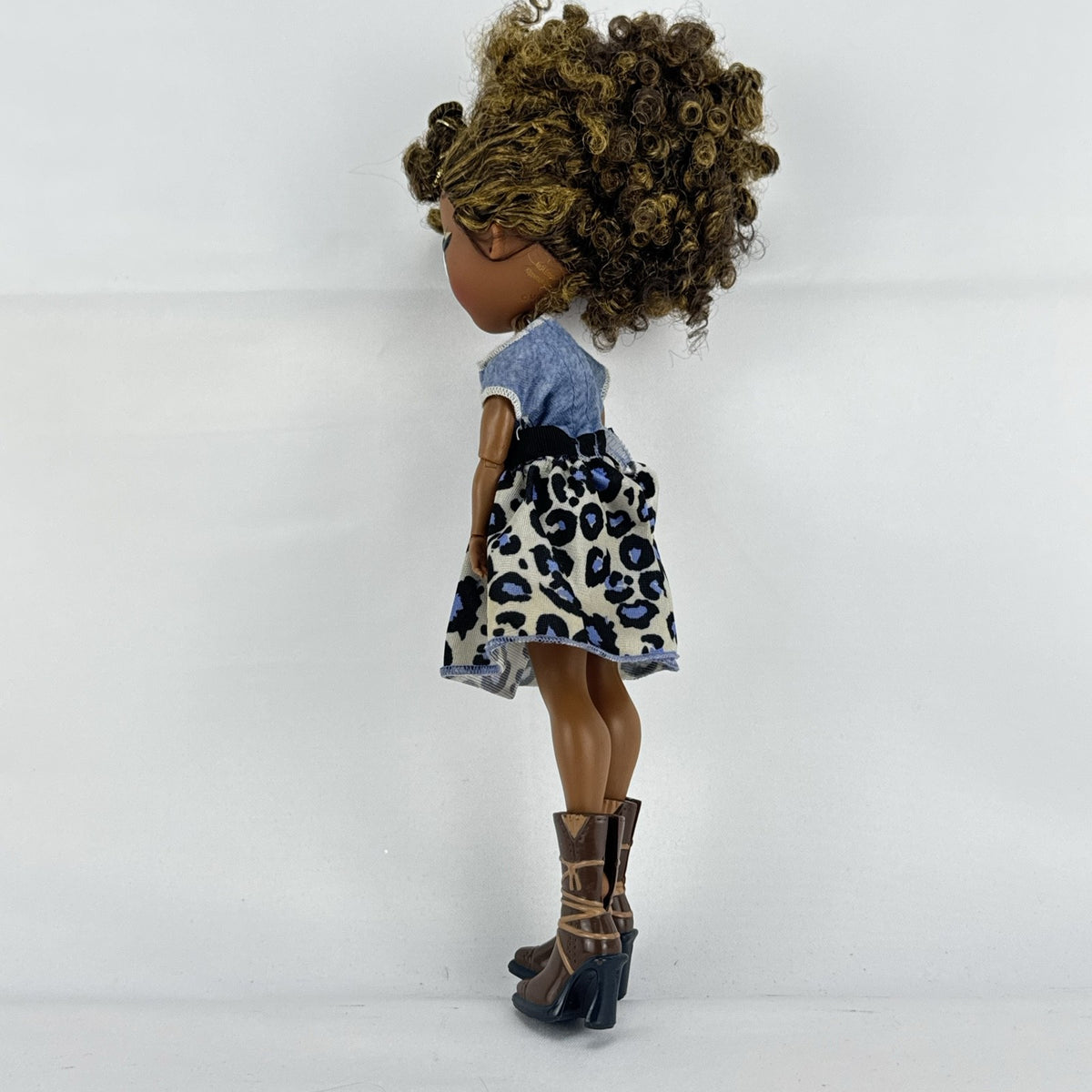 MGA L.O.L. Surprise! O.M.G. Royal Bee fashion doll with curly brown hair in an animal print outfit and lace-up boots
